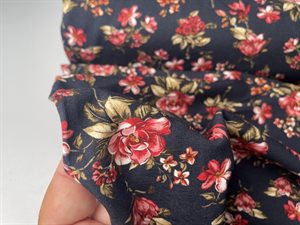 Bomuldsjersey - yndige blomster på marineblå bund